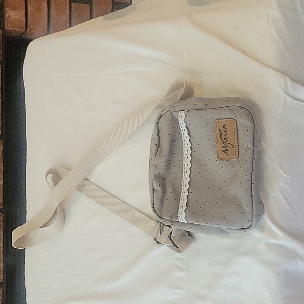 MyGreen Cute purse color gray with tan strap.